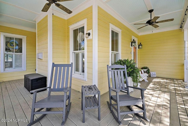 wooden deck with ceiling fan and covered porch