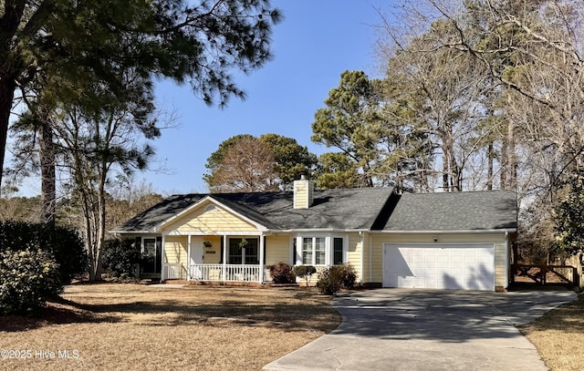 view of front of house featuring a chimney, a porch, a shingled roof, a garage, and driveway