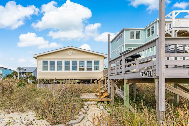 back of house featuring a deck