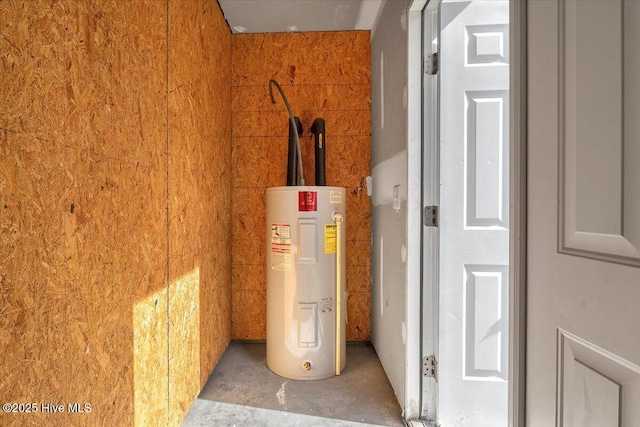 utility room featuring electric water heater