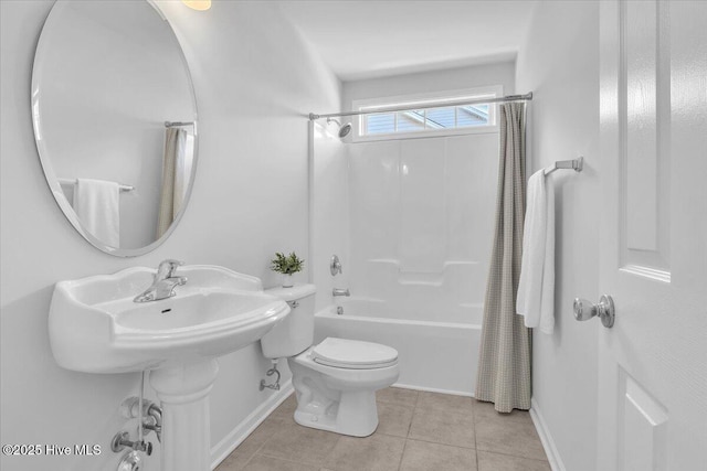 bathroom featuring shower / bath combination with curtain, baseboards, toilet, and tile patterned floors