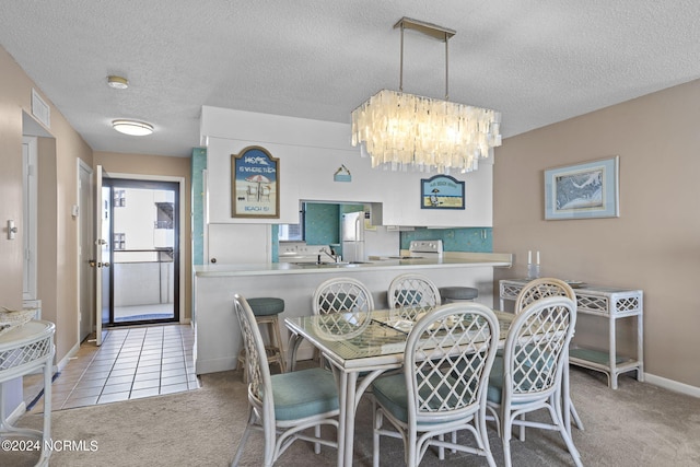 carpeted dining space featuring baseboards, visible vents, tile patterned floors, an inviting chandelier, and a textured ceiling