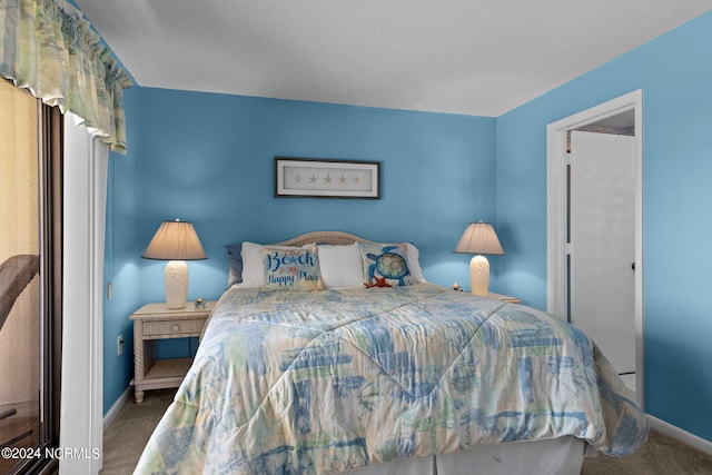 carpeted bedroom featuring baseboards