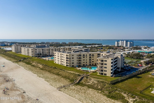 birds eye view of property featuring a water view and a city view