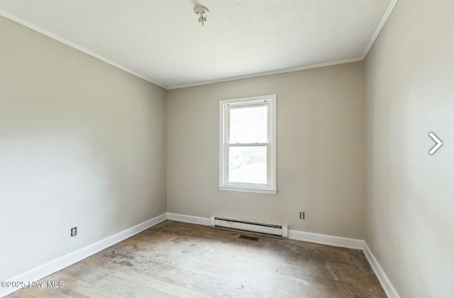315 Glenfield Rd, Snow Hill, NC 28580 - unfurnished room with a baseboard heating unit, crown molding, a textured ceiling, and baseboards