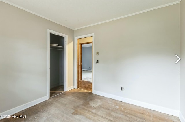 315 Glenfield Rd, Snow Hill, NC 28580 - unfurnished bedroom with crown molding, a closet, wood finished floors, and baseboards