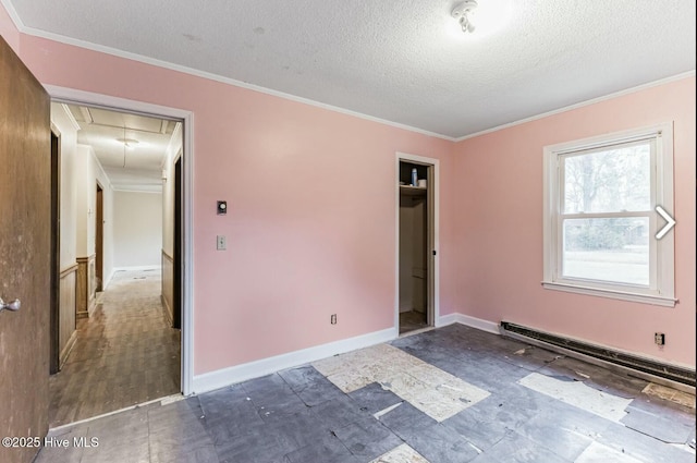 315 Glenfield Rd, Snow Hill, NC 28580 - unfurnished bedroom with attic access, baseboards, ornamental molding, baseboard heating, and a textured ceiling