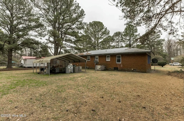 315 Glenfield Rd, Snow Hill, NC 28580 - rear view of house featuring brick siding, a lawn, crawl space, a carport, and driveway