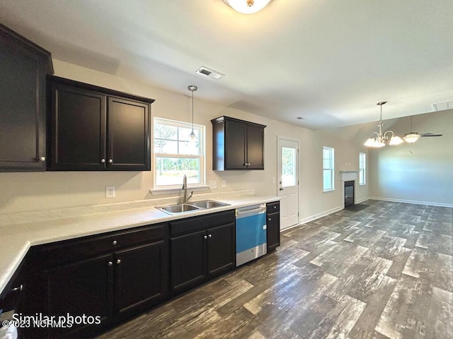 kitchen with dishwasher, plenty of natural light, a sink, and visible vents