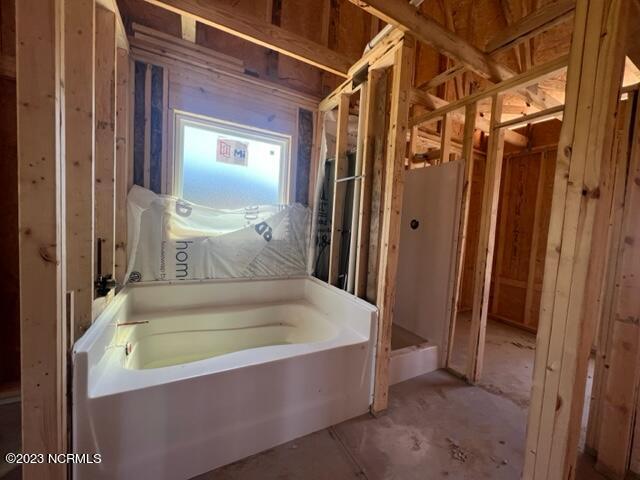 full bathroom featuring a bath