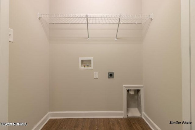 laundry area featuring washer hookup, dark wood-style flooring, hookup for an electric dryer, laundry area, and baseboards