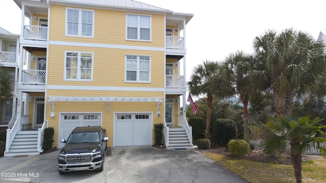 view of front of home with a garage and concrete driveway