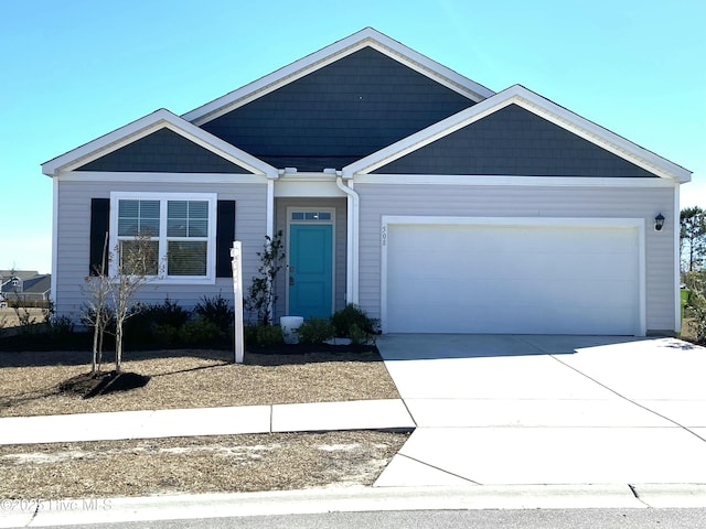 view of front of house featuring a garage and concrete driveway