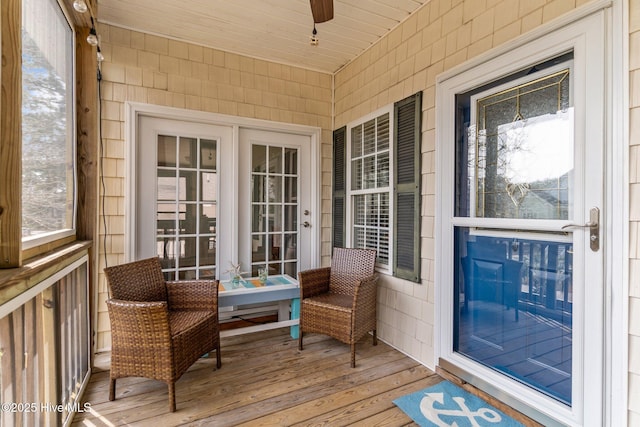 exterior space with ceiling fan