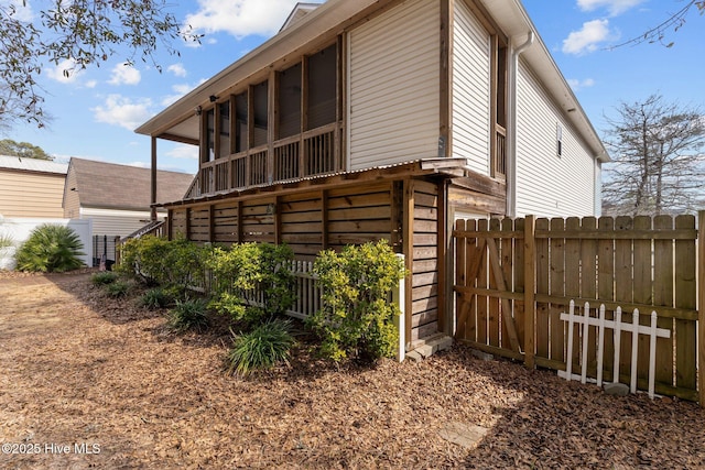 view of side of property with fence