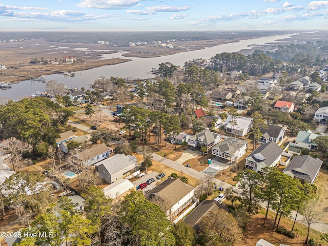 birds eye view of property with a residential view and a water view