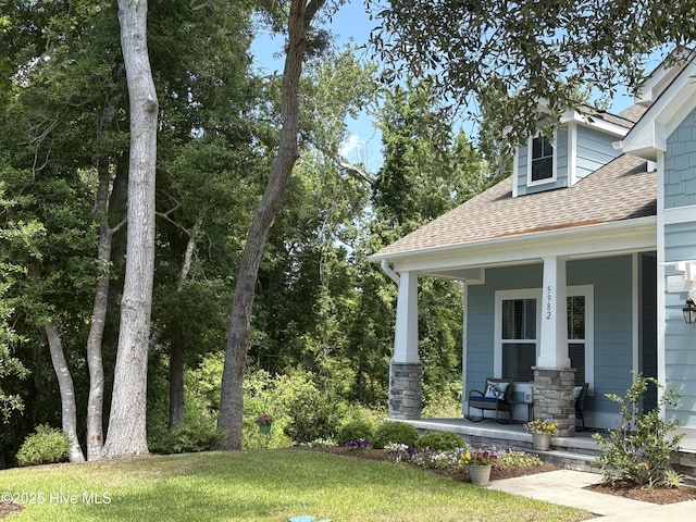 5982 Gray Squirrel Path, Southport, NC 28461 - view of yard with a porch