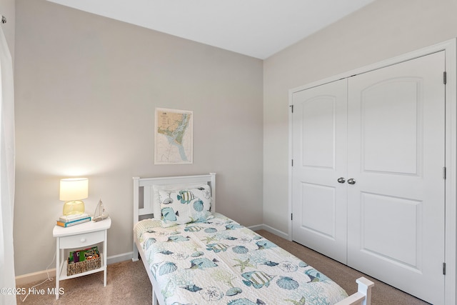 5982 Gray Squirrel Path, Southport, NC 28461 - bedroom featuring a closet, baseboards, and carpet floors