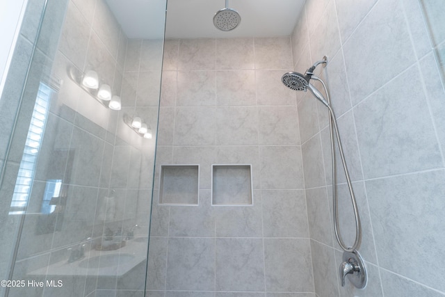 bathroom with a tile shower