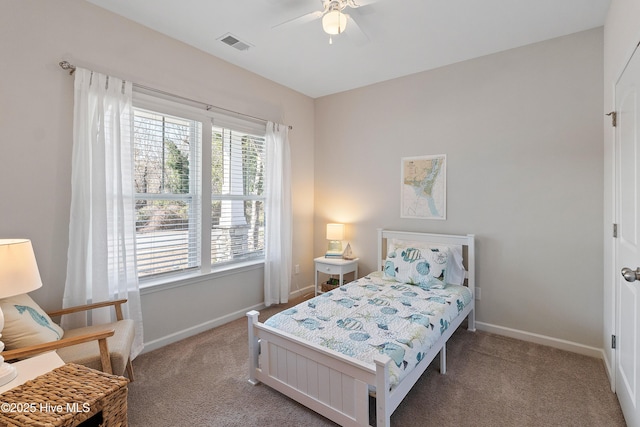 carpeted bedroom featuring visible vents, baseboards, and ceiling fan