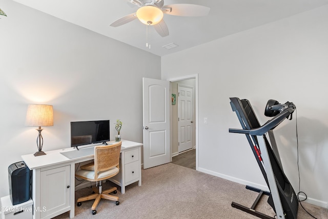 office featuring light colored carpet, baseboards, and ceiling fan