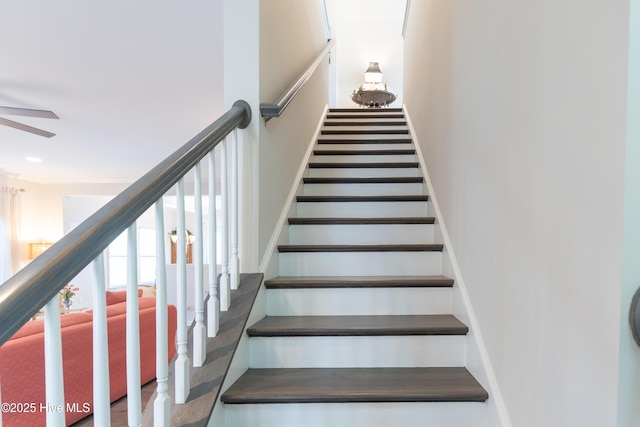 stairway featuring recessed lighting and a ceiling fan