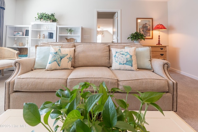 carpeted living room with baseboards