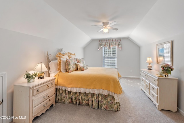 bedroom with baseboards, light carpet, ceiling fan, and vaulted ceiling