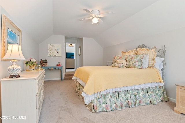 bedroom with ceiling fan, lofted ceiling, baseboards, and light carpet