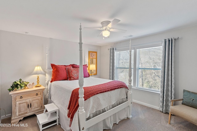 carpeted bedroom featuring visible vents, ceiling fan, and baseboards