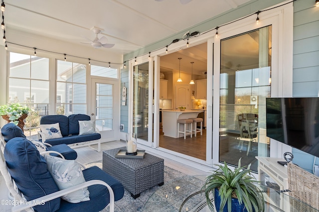 exterior space featuring outdoor lounge area and ceiling fan