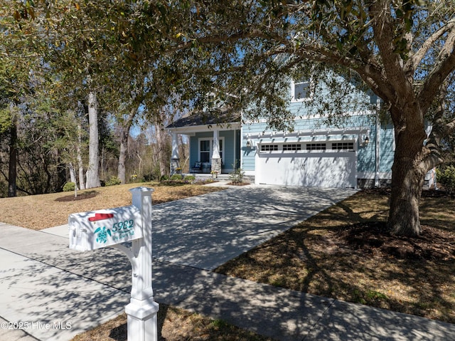 view of front of property featuring driveway and a garage