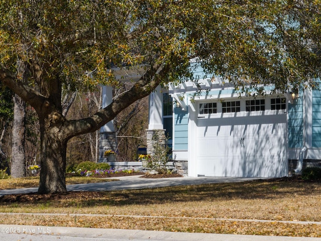 view of side of home with a garage