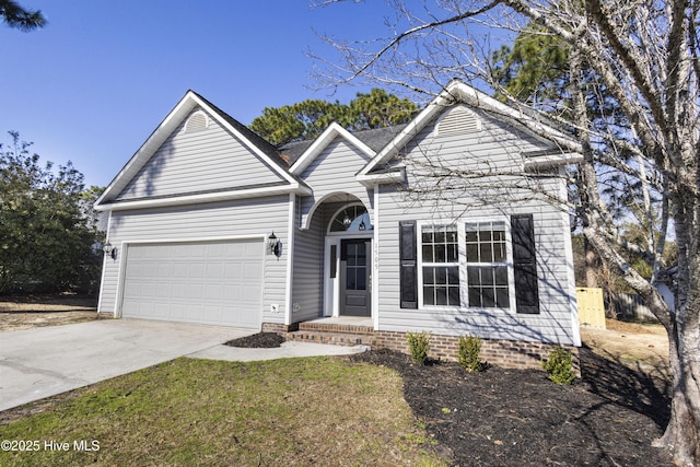 view of front of house with a garage and driveway