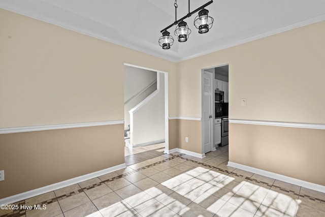 unfurnished dining area featuring a notable chandelier, crown molding, tile patterned floors, and baseboards