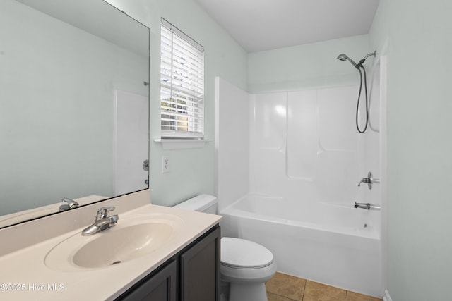 full bath featuring vanity, shower / bathing tub combination, tile patterned flooring, and toilet