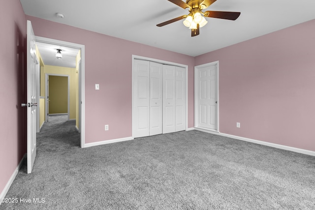 unfurnished bedroom with a closet, carpet, a ceiling fan, and baseboards