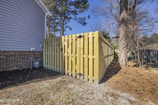 view of gate featuring fence