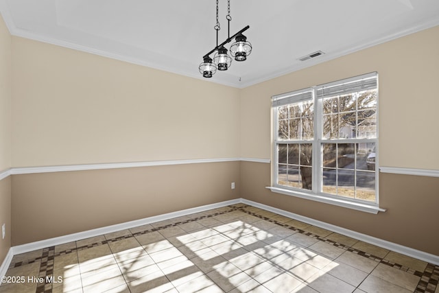 tiled empty room featuring visible vents, baseboards, and a wealth of natural light