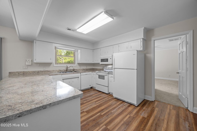 3610 Wedgewood Dr, Trent Woods, NC 28562 - kitchen with white appliances, a sink, light countertops, white cabinetry, and dark wood finished floors