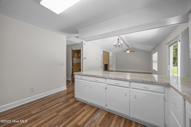 3610 Wedgewood Dr, Trent Woods, NC 28562 - kitchen featuring a chandelier, dark wood finished floors, and white cabinetry