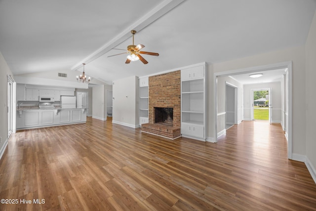 3610 Wedgewood Dr, Trent Woods, NC 28562 - unfurnished living room with baseboards, ceiling fan, wood finished floors, a brick fireplace, and a chandelier