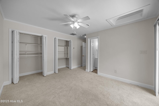 3610 Wedgewood Dr, Trent Woods, NC 28562 - unfurnished bedroom featuring light colored carpet, two closets, baseboards, and ceiling fan