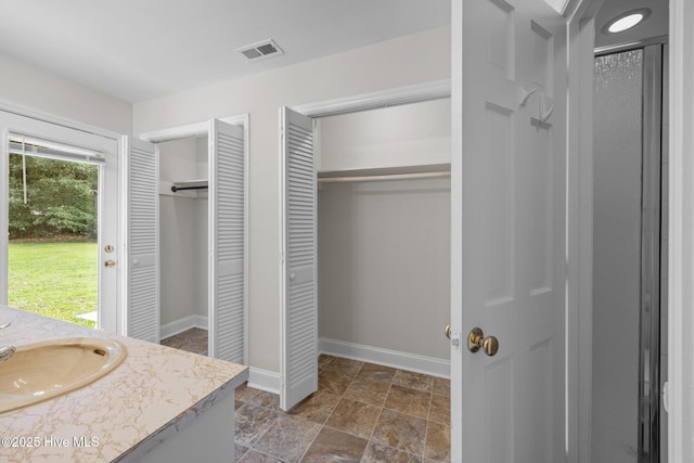 3610 Wedgewood Dr, Trent Woods, NC 28562 - full bathroom with a closet, baseboards, stone finish floors, and vanity
