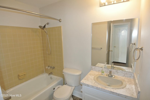 bathroom featuring bathing tub / shower combination, toilet, and vanity