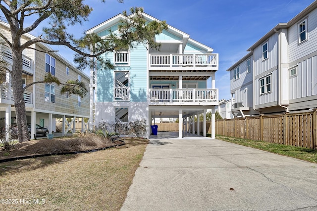 beach home with a carport and concrete driveway