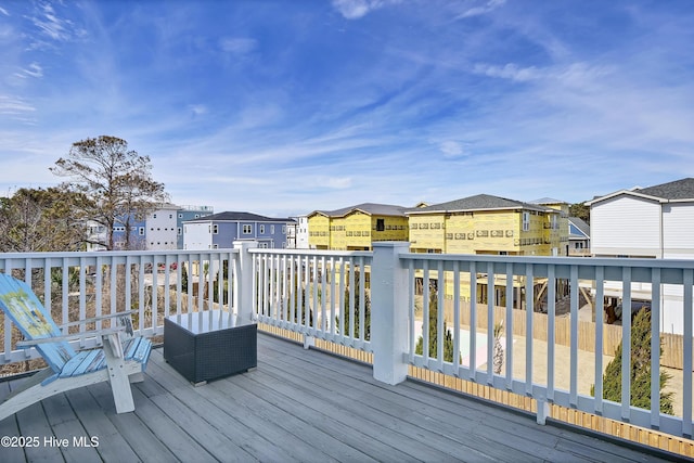 wooden deck with a residential view