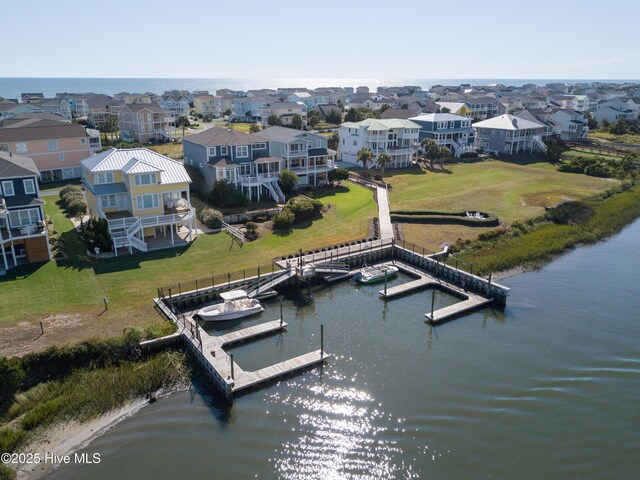 aerial view with a water view and a residential view