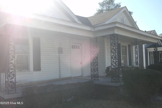 view of exterior entry featuring a porch