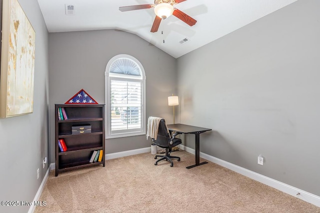 office space with carpet floors, ceiling fan, visible vents, and vaulted ceiling